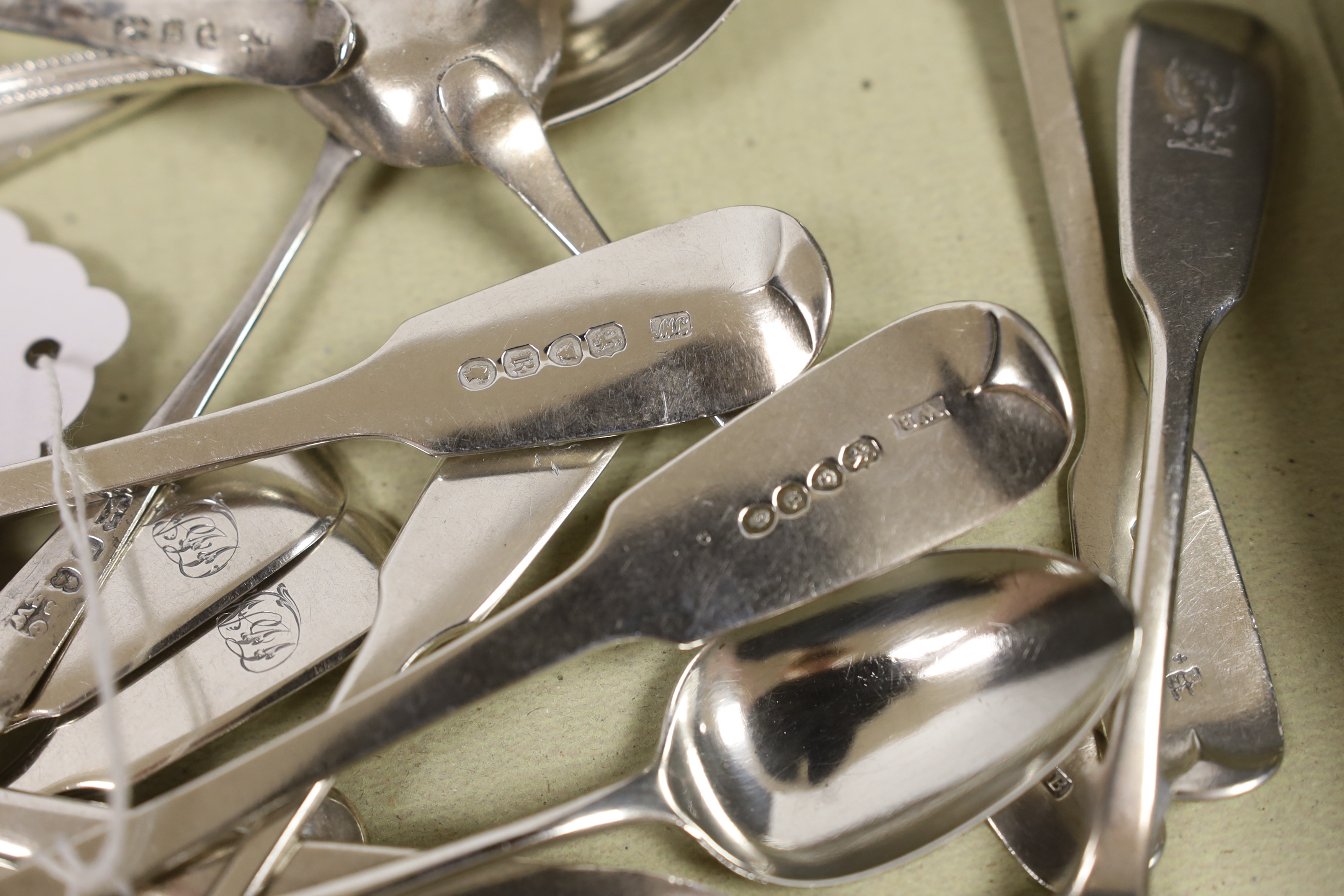 A quantity of assorted 19th century and later silver flatware, including teaspoons, condiment spoons, dessert spoons and a 1930's silver meat skewer